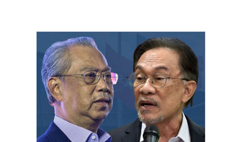 拿督斯里安华(右)与丹斯里慕尤丁。